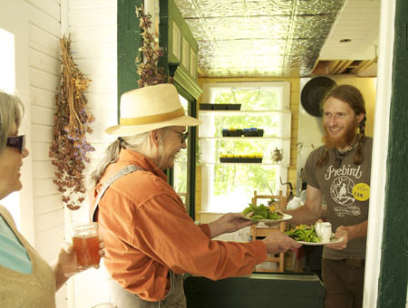 Yan serving some great vegetarian food - Photo by Liz Lott